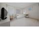 Bright bedroom featuring a single bed, a desk, and light neutral tones at 8108 Via Bella Notte, Orlando, FL 32836