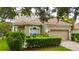 Beautiful home featuring a well-manicured lawn and a classic architectural design at 8108 Via Bella Notte, Orlando, FL 32836