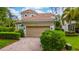 Charming single-Gathering home with well-maintained landscaping and a two-car garage at 8108 Via Bella Notte, Orlando, FL 32836