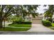 Inviting single Gathering home showcasing a manicured lawn and charming architectural details at 8108 Via Bella Notte, Orlando, FL 32836