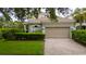 Charming single-Gathering home featuring a two-car garage and a well-manicured lawn and mature landscaping at 8108 Via Bella Notte, Orlando, FL 32836