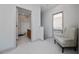 Bright upstairs hallway with access to the bathroom and bedroom at 8108 Via Bella Notte, Orlando, FL 32836