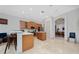 Open kitchen with island and stainless appliances at 8108 Via Bella Notte, Orlando, FL 32836