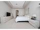 The room features a tray ceiling and serene decor for a relaxing retreat at 8108 Via Bella Notte, Orlando, FL 32836