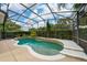 Inviting in-ground swimming pool enclosed with a screened enclosure and lush landscaping at 8108 Via Bella Notte, Orlando, FL 32836