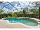Beautiful screened-in pool with tile accents, and lush greenery creating a private backyard oasis at 8108 Via Bella Notte, Orlando, FL 32836