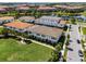 Beautiful aerial shot of a residential community with tile-roofed homes and well-maintained landscaping near a lake at 10108 Sunnifa Aly, Orlando, FL 32832