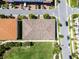 Overhead shot of a perfectly maintained roof with lush yard and manicured sidewalks in a suburban neighborhood at 10108 Sunnifa Aly, Orlando, FL 32832