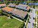 Multi-Gathering homes face a grassy open space with a view of a pond with a fountain at 10108 Sunnifa Aly, Orlando, FL 32832