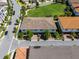 Beautiful roof on corner lot across the street from open lawn with a small tree line at 10108 Sunnifa Aly, Orlando, FL 32832