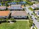 Multi-Gathering homes face a grassy open space, and have a view of a nearby pond at 10108 Sunnifa Aly, Orlando, FL 32832