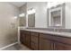 Modern bathroom with a glass-enclosed shower and double vanity with granite countertop at 10108 Sunnifa Aly, Orlando, FL 32832