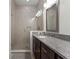 Well-appointed bathroom featuring a glass-enclosed shower and a vanity with granite countertop at 10108 Sunnifa Aly, Orlando, FL 32832