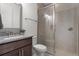 The well-lit bathroom features a glass enclosed shower and granite vanity at 10108 Sunnifa Aly, Orlando, FL 32832