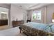 Serene bedroom featuring a window, dresser, and closet at 10108 Sunnifa Aly, Orlando, FL 32832