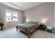 Cozy bedroom with a large window, neutral tones, and comfortable furnishings at 10108 Sunnifa Aly, Orlando, FL 32832