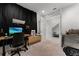 Bright home office features modern desk, ergonomic chair, black out curtains and neutral carpet flooring at 10108 Sunnifa Aly, Orlando, FL 32832