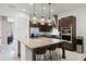 Modern kitchen island with pendant lighting, stainless appliances, and bar seating perfect for entertaining at 10108 Sunnifa Aly, Orlando, FL 32832