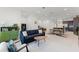 Open-concept living room flowing into dining and kitchen areas, complete with modern furnishings and stylish decor at 10108 Sunnifa Aly, Orlando, FL 32832
