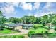 A serene aerial view of a home with a screened pool and well-maintained lawn at 1071 Deer Run Dr, Winter Springs, FL 32708