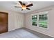 Bedroom featuring a closet, window with natural light, and neutral walls, complemented by plush gray carpet at 1071 Deer Run Dr, Winter Springs, FL 32708