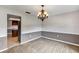 This carpeted dining room features neutral walls, decorative chair rail, and chandelier at 1071 Deer Run Dr, Winter Springs, FL 32708