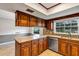 Beautiful kitchen featuring granite countertops, tile backsplash, and wood cabinetry at 1071 Deer Run Dr, Winter Springs, FL 32708