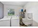 Functional laundry room featuring a washer, dryer, utility sink, and water heater at 1071 Deer Run Dr, Winter Springs, FL 32708