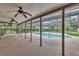 Relaxing screened-in pool area with ceiling fans, offering a private outdoor space at 1071 Deer Run Dr, Winter Springs, FL 32708