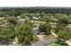 Aerial view of a home with a dark roof, close to Orlando, in a lush, green neighborhood with pools at 1105 Appleton Ave, Orlando, FL 32806