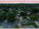 Residential neighborhood featuring mature trees and distant city skyline at 1105 Appleton Ave, Orlando, FL 32806
