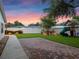 Backyard featuring a brick patio, lush green lawn, and a play set perfect for outdoor activities at 1105 Appleton Ave, Orlando, FL 32806