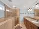 Bathroom showcasing a glass shower, granite vanity, and tile floors at 1105 Appleton Ave, Orlando, FL 32806