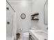 Stylish bathroom boasting a marble shower, modern fixtures, and floating shelves at 1105 Appleton Ave, Orlando, FL 32806