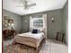 Inviting bedroom with grey-green walls, vintage desk, and plush area rug at 1105 Appleton Ave, Orlando, FL 32806