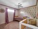 Unique Bedroom featuring custom moon wall, wood floors and neutral area rug at 1105 Appleton Ave, Orlando, FL 32806