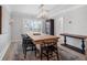 Bright dining room featuring a wooden table, black woven chairs, and modern lighting at 1105 Appleton Ave, Orlando, FL 32806