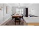 Formal dining room with a large wooden table, seating for eight, and wainscotting at 1105 Appleton Ave, Orlando, FL 32806