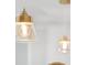 Close-up of hanging dining room lights with bulbs in glass casings at 1105 Appleton Ave, Orlando, FL 32806