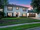 Classic two-story home with a dark roof, neat landscaping, and a freshly mowed lawn at 1105 Appleton Ave, Orlando, FL 32806