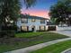 Inviting two-story home with lush landscaping and a neatly maintained lawn at 1105 Appleton Ave, Orlando, FL 32806
