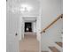 Hallway with light hardwood floors and a view to a study at 1105 Appleton Ave, Orlando, FL 32806