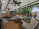 Relaxing screened patio with outdoor furniture and view of the landscaped backyard at 1105 Appleton Ave, Orlando, FL 32806