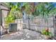 Backyard patio space featuring a wood fence, foliage, and a concrete patio at 1117 Park Green Pl, Winter Park, FL 32789