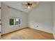 Bedroom featuring wood floors, neutral walls, and a window with a blind shade at 1117 Park Green Pl, Winter Park, FL 32789