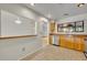 Clean kitchen with stainless steel appliances, wood cabinets, and view to living room at 1117 Park Green Pl, Winter Park, FL 32789