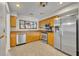 Kitchen featuring stainless steel appliances, wood cabinets, and modern fixtures at 1117 Park Green Pl, Winter Park, FL 32789