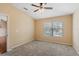 Neutral bedroom with carpeting, a ceiling fan, and a window for natural light at 1210 San Jacinto Cir, Sanford, FL 32771