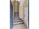 Tiled foyer featuring carpeted stairs leading to the upper level of the home at 1210 San Jacinto Cir, Sanford, FL 32771