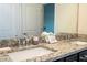 Bathroom vanity with double sinks, granite countertops, and brushed metal fixtures at 1292 Blue Island Dr, Clermont, FL 34714